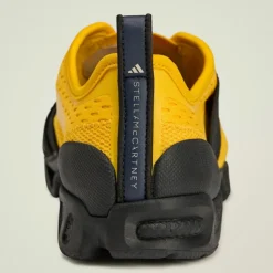 adidas Fitnessschuhe<· by Stella McCartney Sportswear X Bold Gold / Legend Ink / Core Black