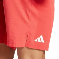 adidas Tennis<· Ergo 7IN semi lucid red