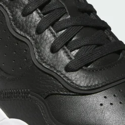 adidas Multifunktionsschuhe<· Retrocross 25 Spikeless Golfschuh Core Black / Cloud White / Gum